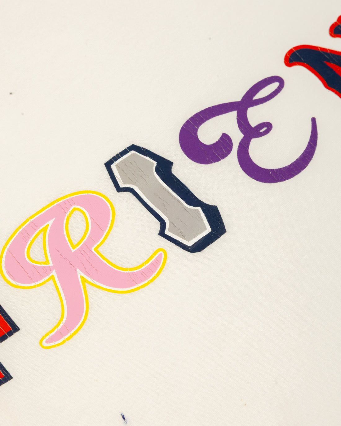 Colorful Friends lettering detail on the Vintage Friends Tee