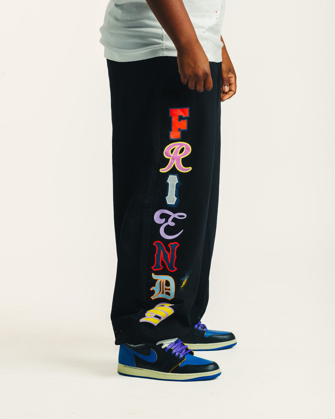 Friends Sweats in black, side view of Friends lettering