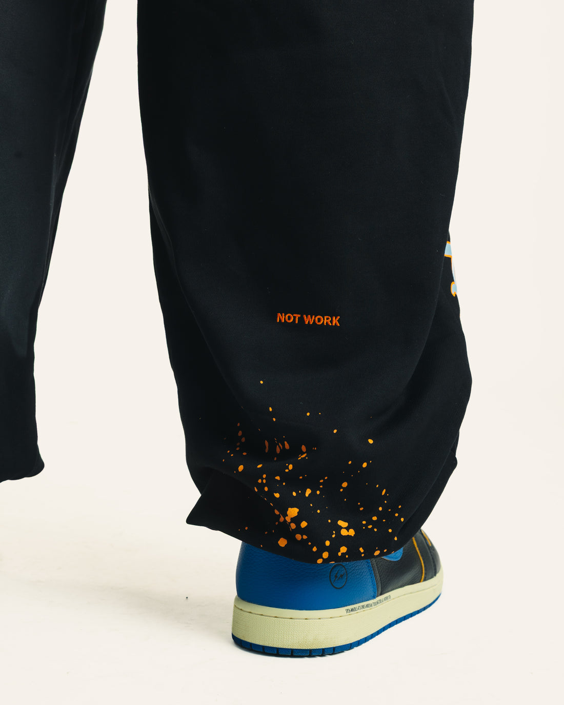Gathered cuff and paint splatter detail on Friends Sweats