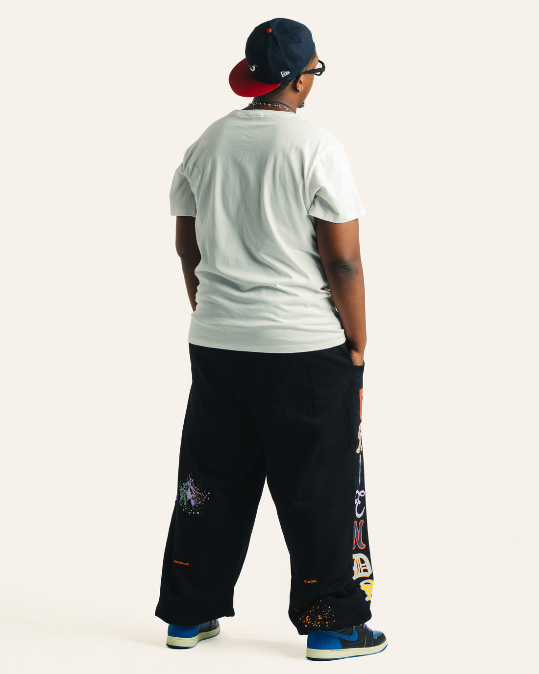 Friends Sweats in black and Vintage Friends Tee in white, back fit on model
