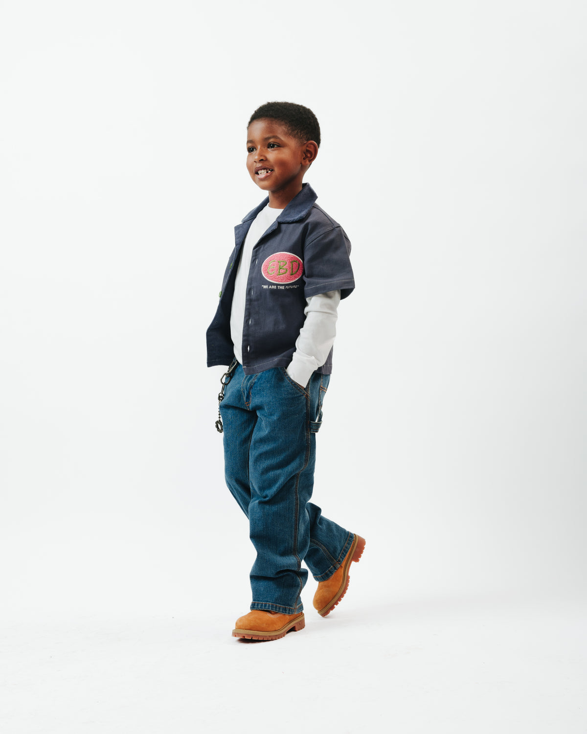 Child wearing the Denim Blue Kids Workshirt with jeans and boots