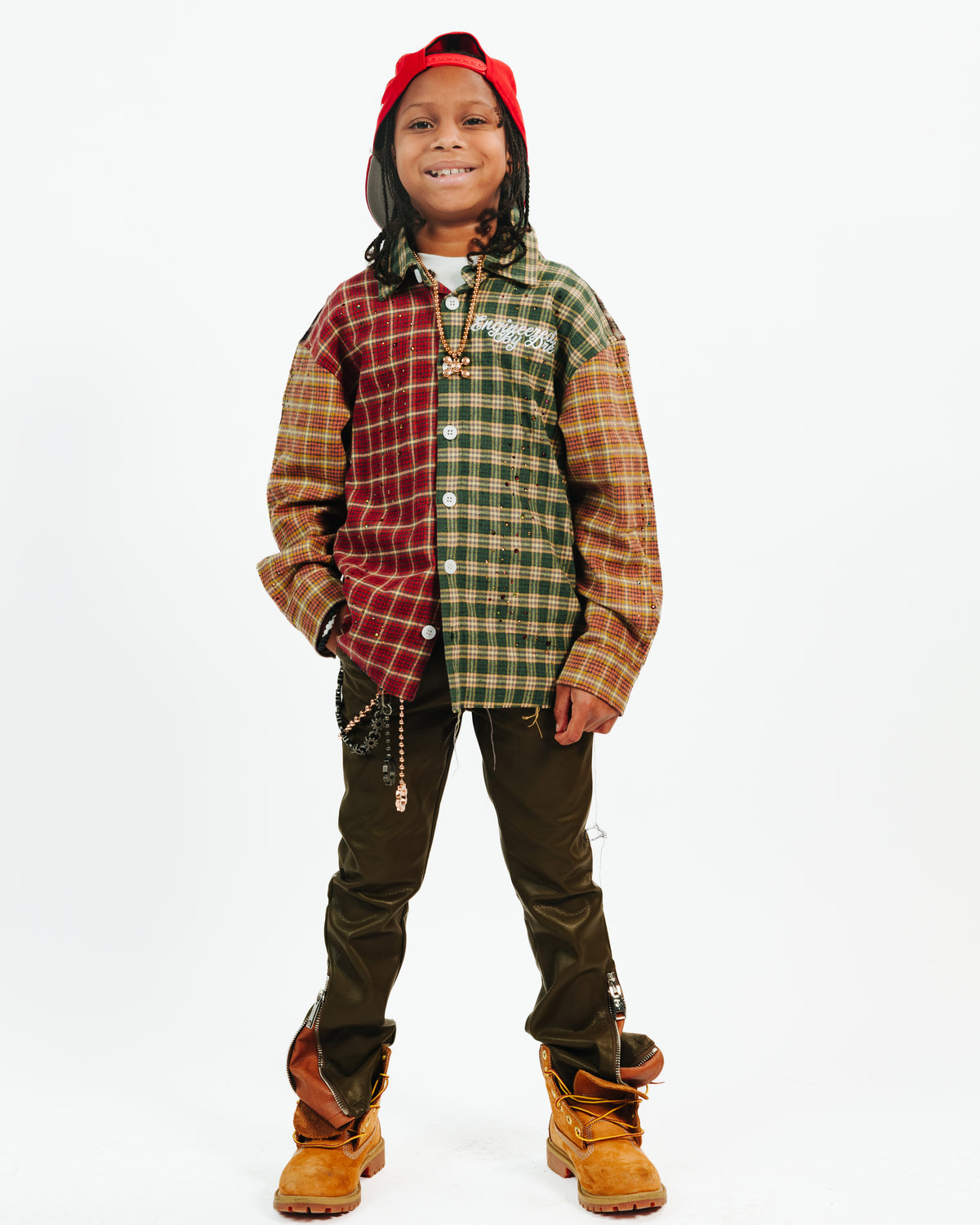 Child wearing the multicolor EBD Kids Flannel and a red cap